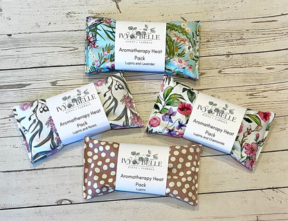Four differently patterned aromatherapy heat packs containing lupins.